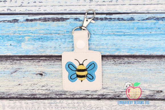 Striped Flying Bee Key Fob: A Versatile Embroidery Design for Boutique Apparel